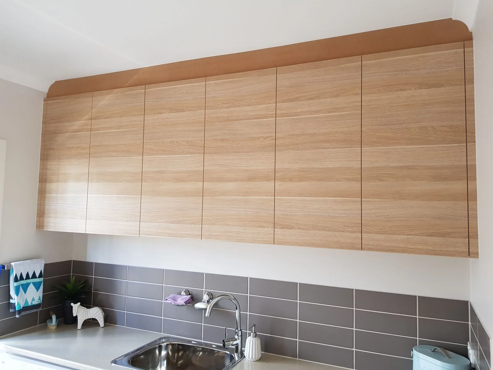 Built-in wardrobe with white hinged doors and internal shelving