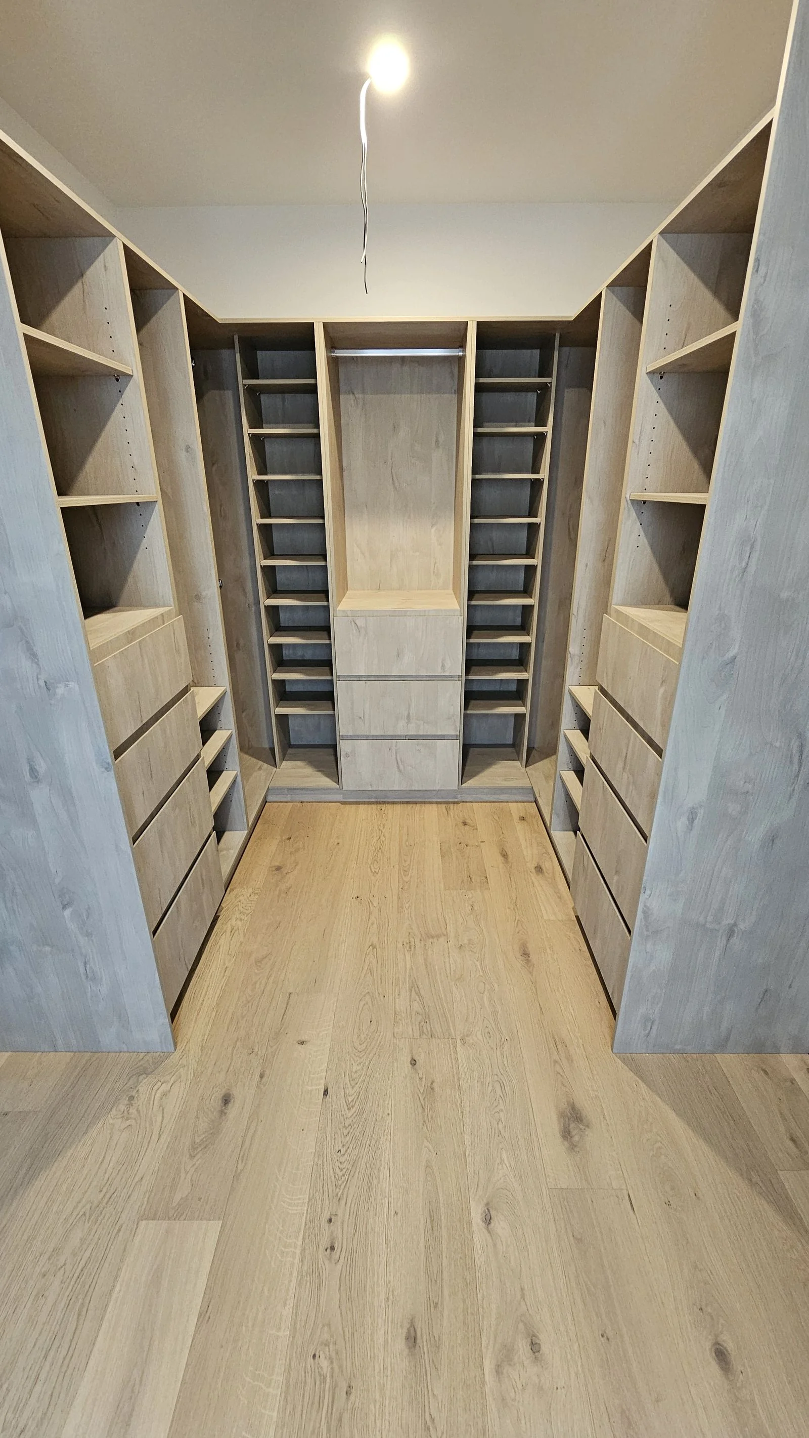 Built-in wardrobe with drawers and hanging space fitted by Brodco