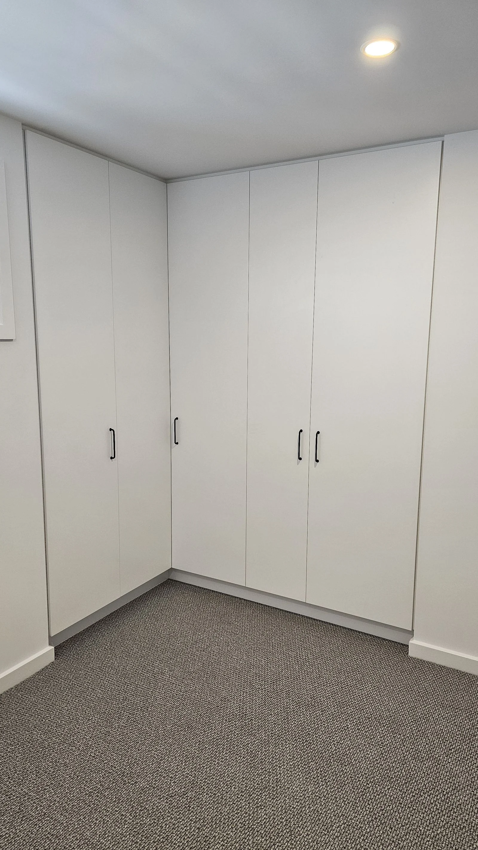 Built-in wardrobe cabinetry installed by Brodco in a customer's bedroom