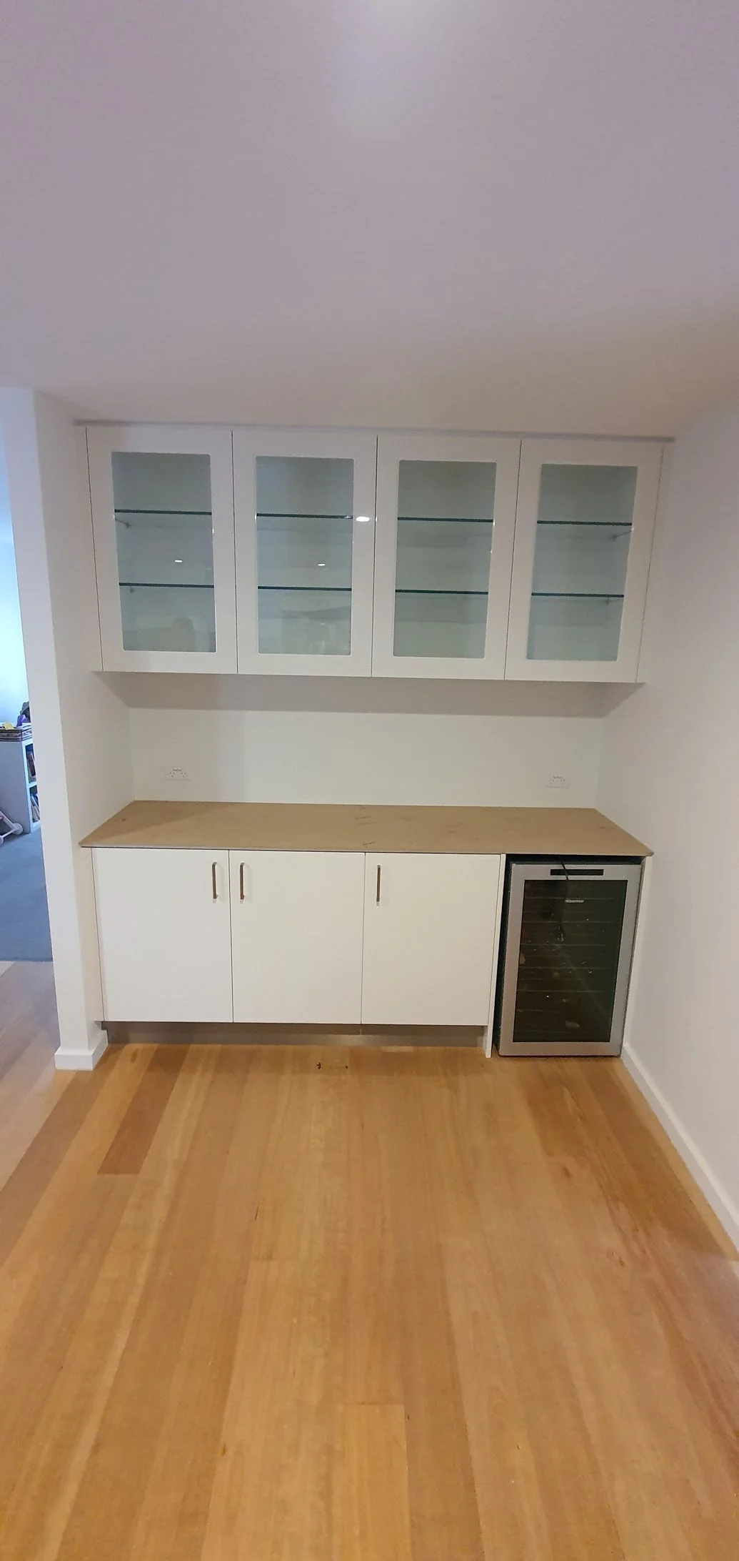 Built-in wardrobe with timber-look hinged doors