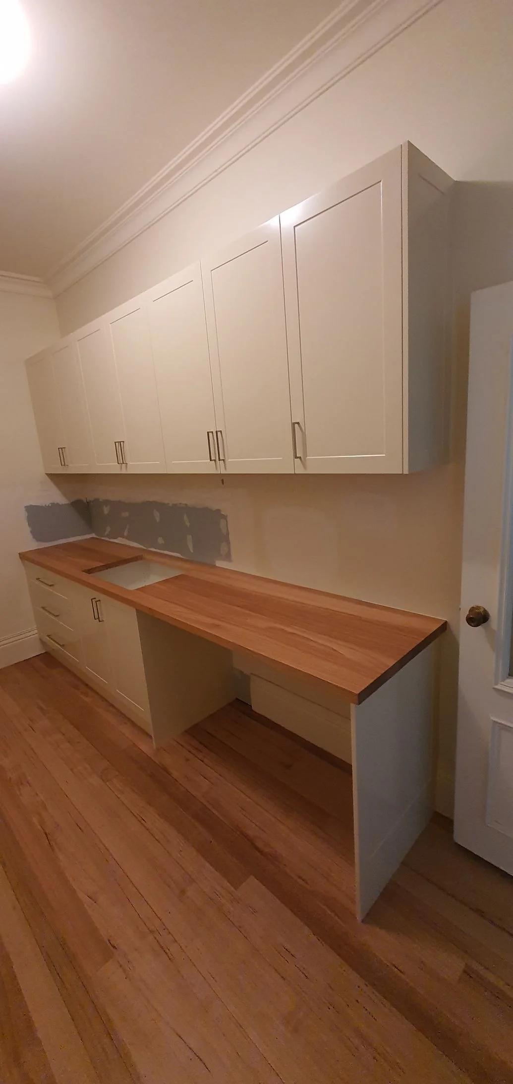 Custom wardrobe with a mix of hanging space and open shelving