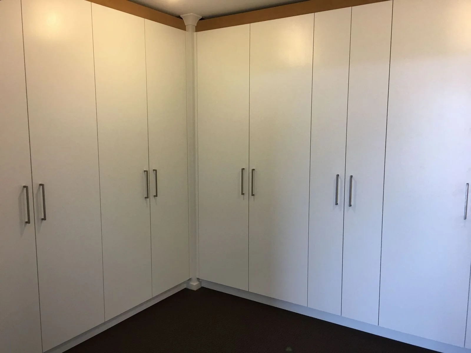 Built-in wardrobe with timber-look sliding doors