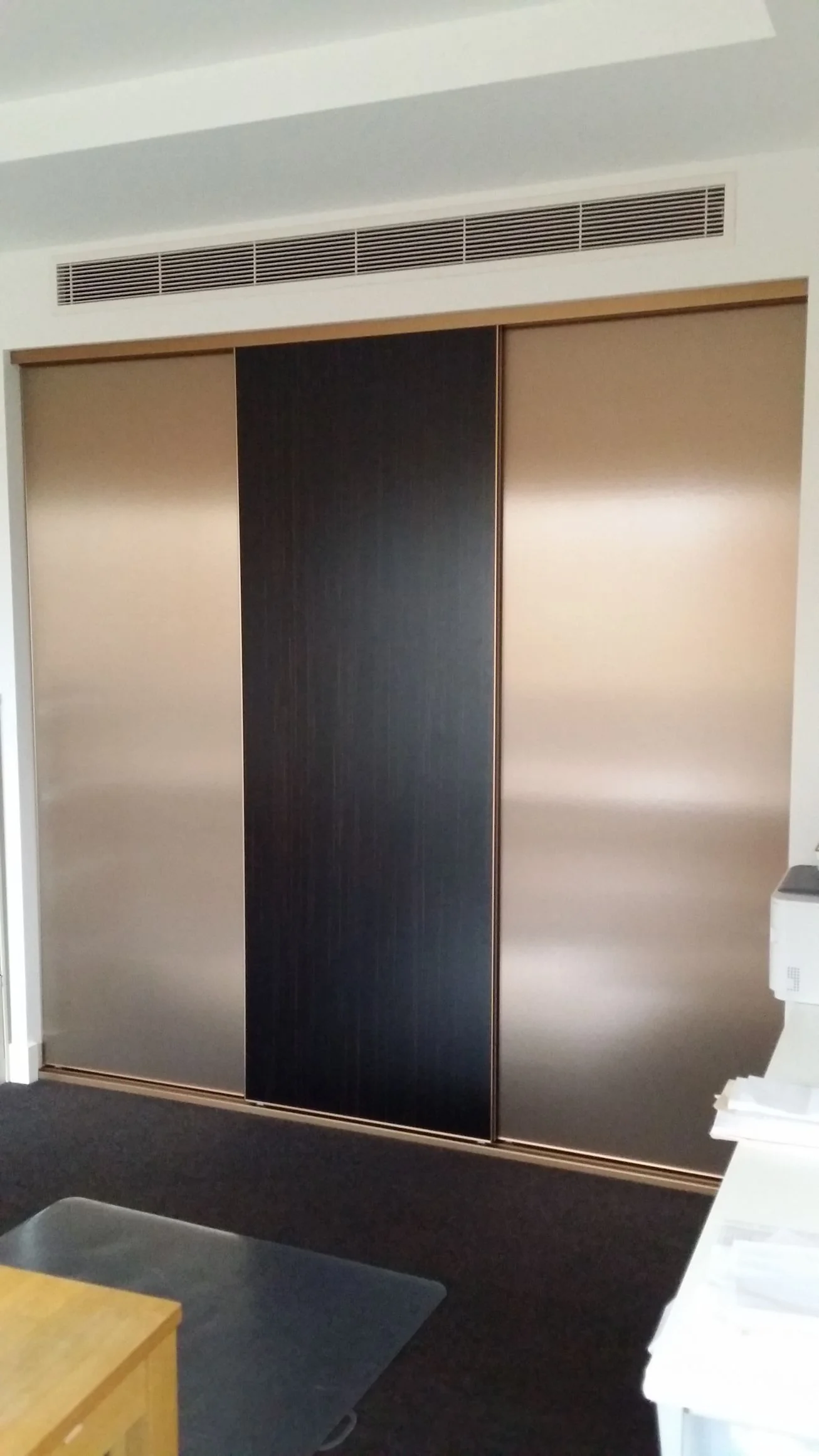 Built-in wardrobe with timber-panel hinged doors