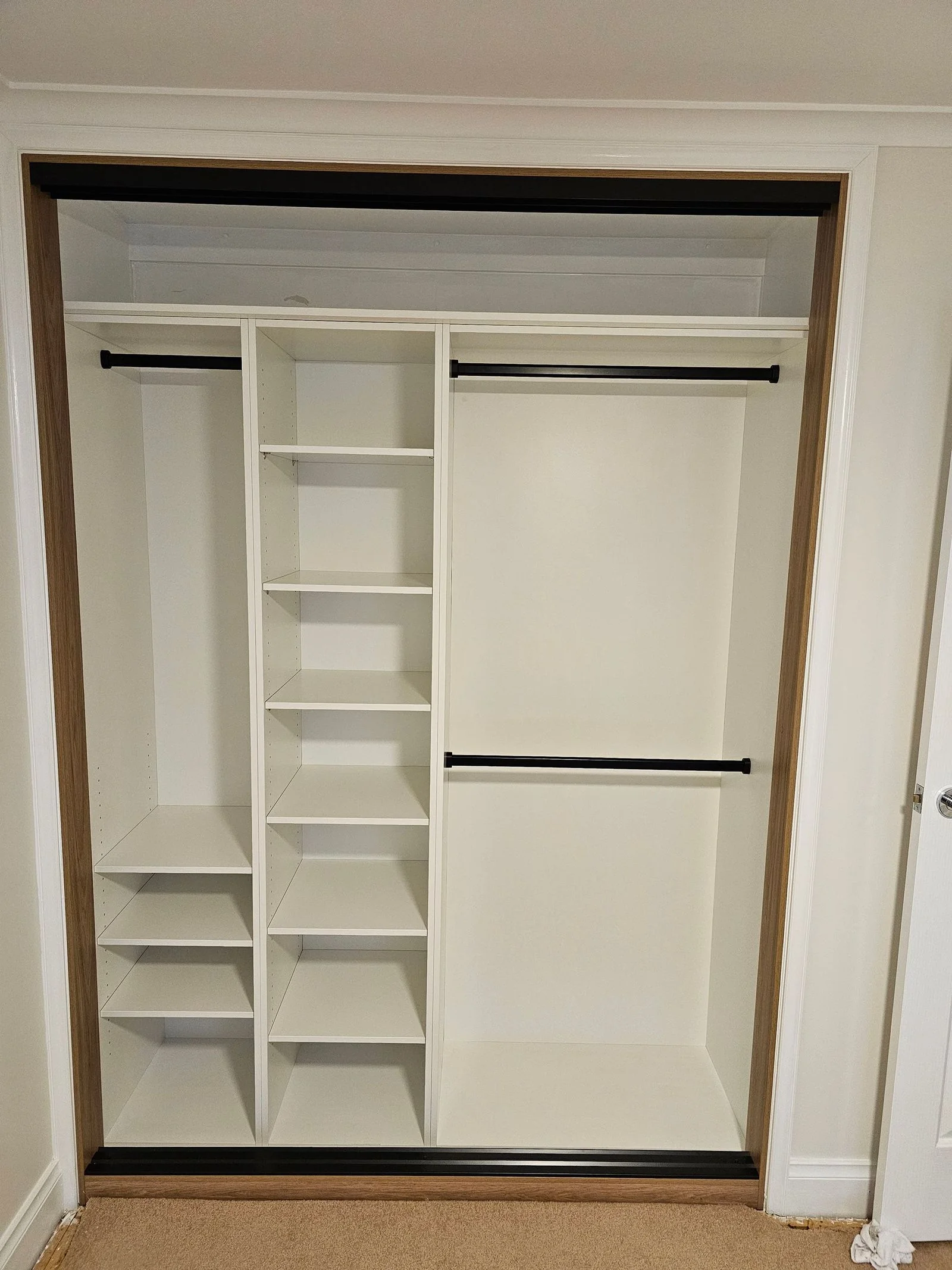 Built-in wardrobe with frosted glass sliding doors