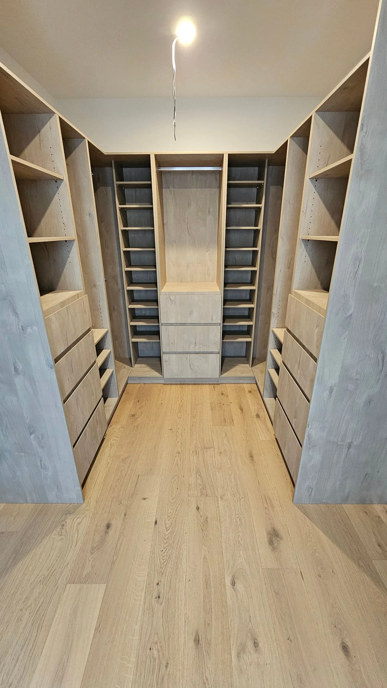 Walk-in wardrobe with open shelving and hanging space