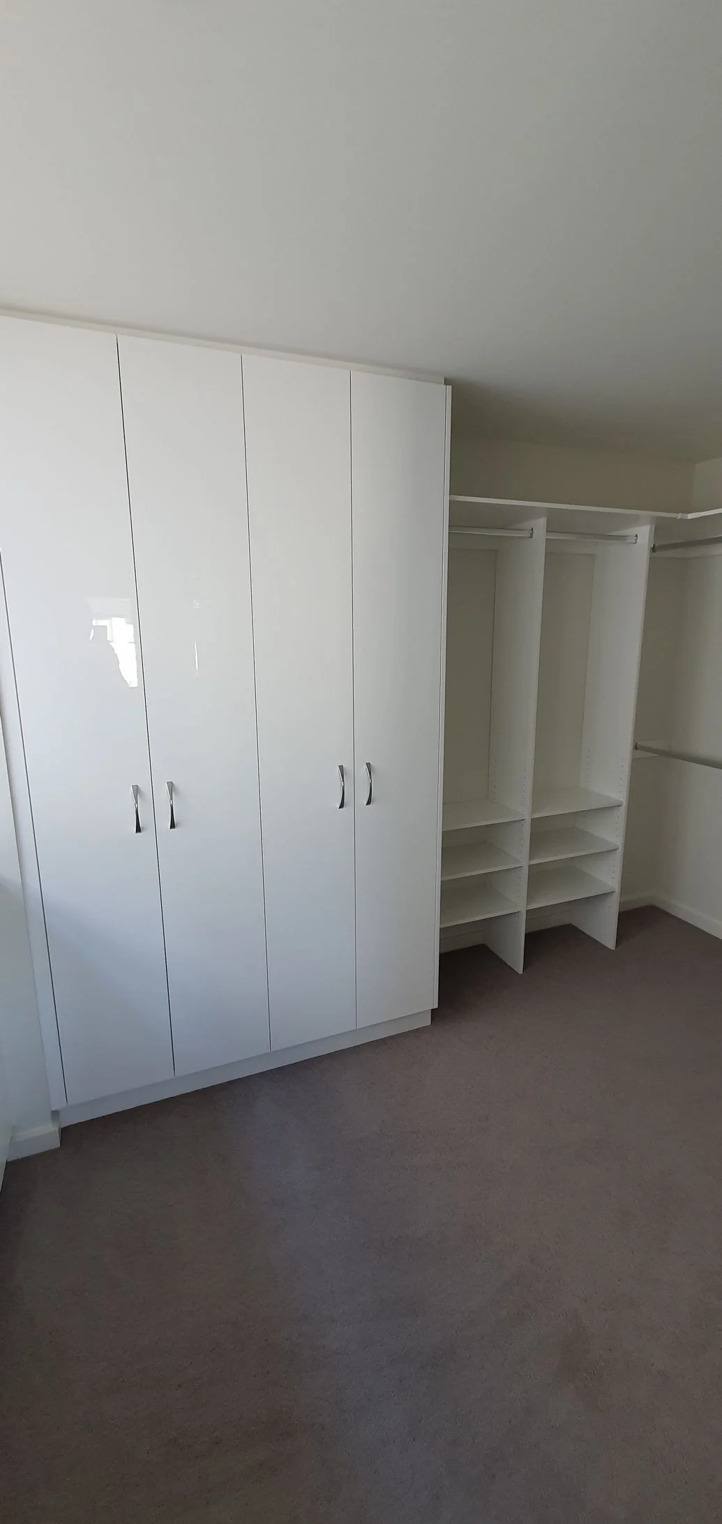 Built-in wardrobe with timber-panel sliding doors