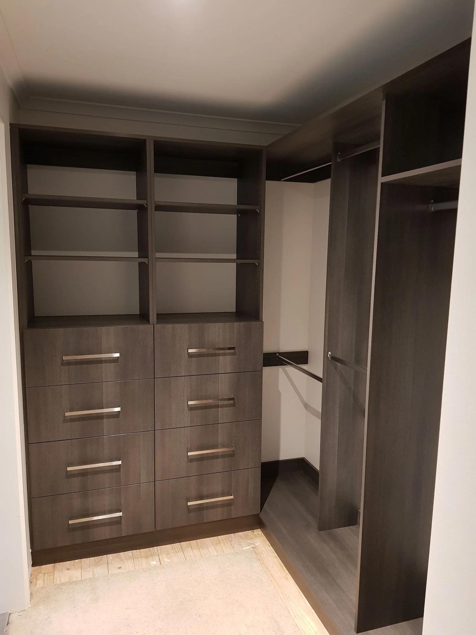 Large walk-in wardrobe with island bench and hanging bays