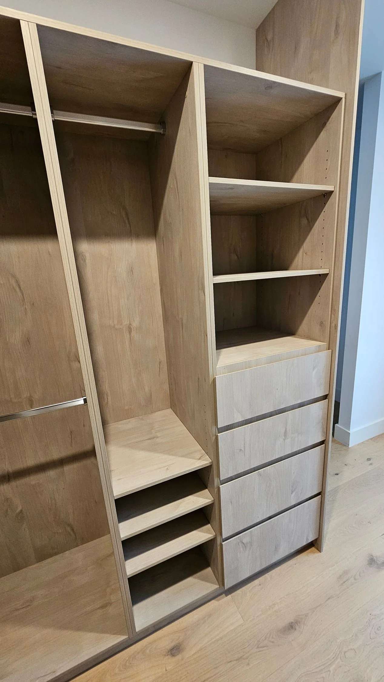 Walk-in wardrobe with open shelving and hanging space