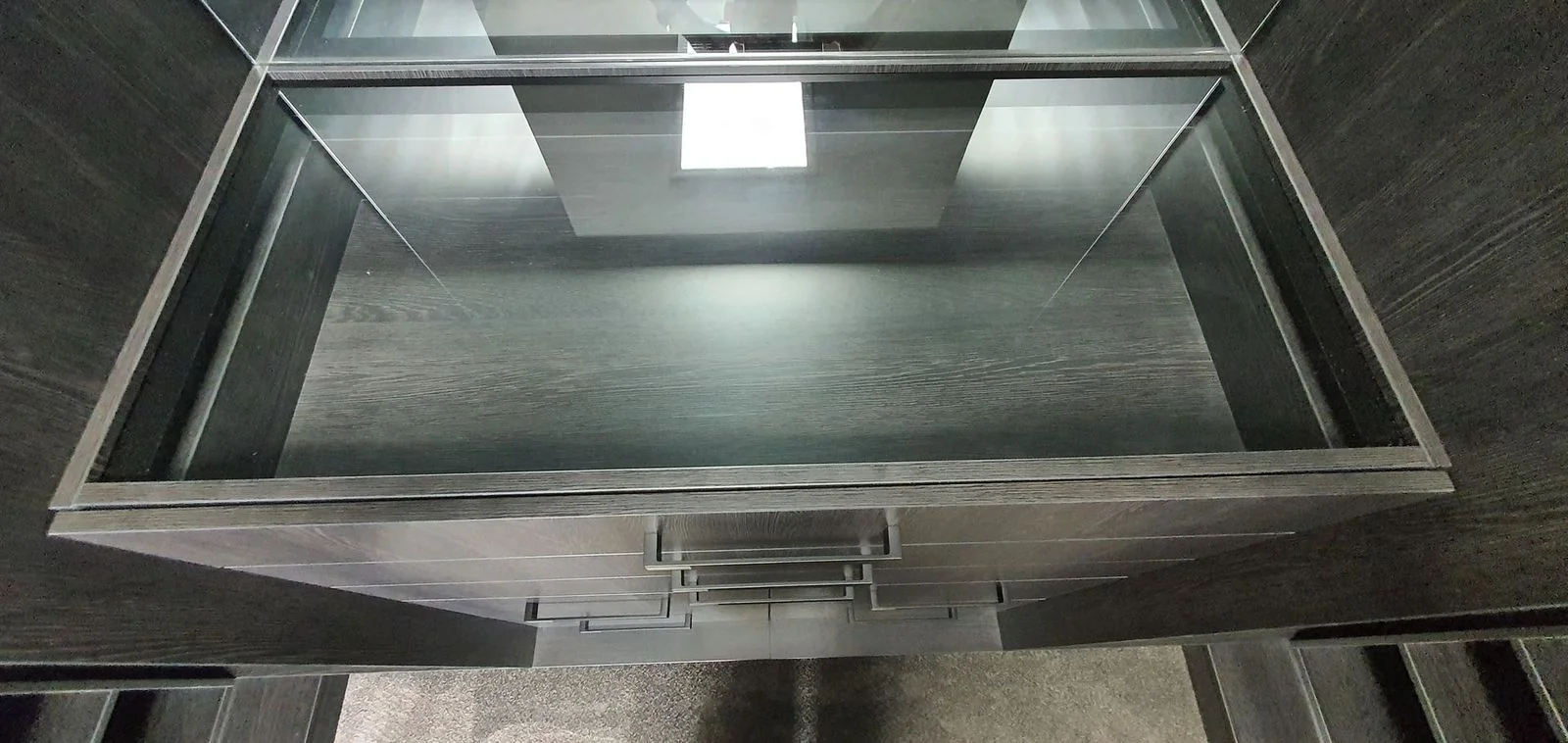 Built-in wardrobe with white hinged doors and internal drawers