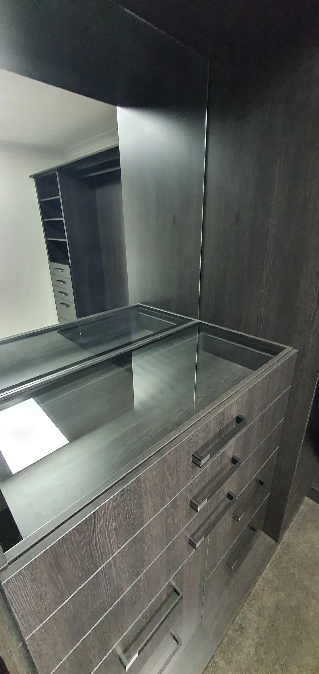 Walk-in wardrobe with floor-to-ceiling shelving